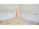 Neutral bedroom features tile floors, a closet, and ample natural light at 1676 Moores Mill Nw Rd, Atlanta, GA 30327