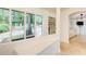 Bright entryway features stone floors, a built-in buffet, and backyard views through large picture windows at 1676 Moores Mill Nw Rd, Atlanta, GA 30327