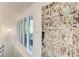 Elegant entryway featuring a decorative door, transom windows, and a stylish pendant light at 1676 Moores Mill Nw Rd, Atlanta, GA 30327