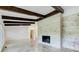 Spacious living room features stone fireplace, high ceilings, and beautiful tile floors at 1676 Moores Mill Nw Rd, Atlanta, GA 30327