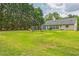 Spacious backyard with lush green grass and play set, perfect for outdoor activities and relaxation at 2606 Fairmont Park Ct, Dacula, GA 30019