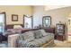 Comfortable bedroom with a large bed, sofa, and natural light at 2606 Fairmont Park Ct, Dacula, GA 30019