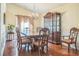 Elegant dining room with hardwood floors, chandelier, and a large dining table at 2606 Fairmont Park Ct, Dacula, GA 30019