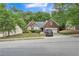 Charming brick home with a two-car garage and well-maintained lawn and landscaping at 2606 Fairmont Park Ct, Dacula, GA 30019
