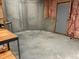 Unfinished basement with a concrete floor, walls, and an exit door at 4091 Oberon Se Ct, Smyrna, GA 30080