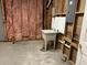 Unfinished basement with a concrete floor, walls, and a utility sink at 4091 Oberon Se Ct, Smyrna, GA 30080