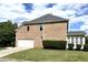Side view of this brick home with manicured lawn and an attached two car garage at 4091 Oberon Se Ct, Smyrna, GA 30080