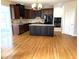 Spacious kitchen featuring custom cabinets, an island with a light countertop, and stainless steel appliances at 4091 Oberon Se Ct, Smyrna, GA 30080