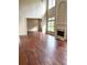 Elegant living room with fireplace, hardwood floors, and high ceilings providing ample natural light at 4091 Oberon Se Ct, Smyrna, GA 30080