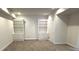 Inviting living room featuring built-in bookshelves and carpet floors at 4091 Oberon Se Ct, Smyrna, GA 30080