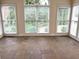 Bright sunroom with tile floors and large windows at 4091 Oberon Se Ct, Smyrna, GA 30080