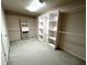Large walk-in closet with custom shelving and hanging rods at 4091 Oberon Se Ct, Smyrna, GA 30080
