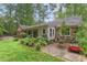 Spacious backyard features mature landscaping, a patio area, and plenty of room for outdoor activities at 491 Hemlock Sw Dr, Marietta, GA 30064