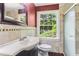 Bathroom featuring tile surround, vanity, and walk-in shower at 491 Hemlock Sw Dr, Marietta, GA 30064