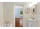 Hall bathroom with vintage tile, sink, and tub at 491 Hemlock Sw Dr, Marietta, GA 30064