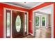 Inviting foyer featuring a decorative glass front door and hardwood floors at 491 Hemlock Sw Dr, Marietta, GA 30064