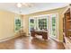 Bright home office features hardwood floors, built-in bookcase, and large windows with beautiful outside views at 491 Hemlock Sw Dr, Marietta, GA 30064