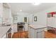 Kitchen with stainless steel appliances, wood flooring and white cabinets at 491 Hemlock Sw Dr, Marietta, GA 30064