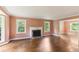 Bright living room featuring a fireplace, hardwood floors, and natural light at 491 Hemlock Sw Dr, Marietta, GA 30064