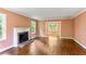 Light filled living room with fireplace and hardwood flooring at 491 Hemlock Sw Dr, Marietta, GA 30064