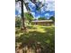 Beautiful backyard with lush lawn and a view of the home's exterior, creating a serene outdoor space at 1736 Almand Creek Sw Dr, Conyers, GA 30094