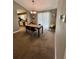 Stylish dining area adjacent to the kitchen with modern lighting and a view of the kitchen at 1736 Almand Creek Sw Dr, Conyers, GA 30094
