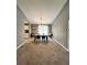 Open dining area with a modern table set, neutral paint, and carpet flooring for cozy Gathering meals at 1736 Almand Creek Sw Dr, Conyers, GA 30094