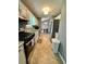 Well-organized kitchen featuring modern appliances, granite countertops, and seamless flow into the dining area at 1736 Almand Creek Sw Dr, Conyers, GA 30094