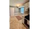 Cozy kitchen area with wood-look flooring, adjacent to the cooking area, and offering extra space at 1736 Almand Creek Sw Dr, Conyers, GA 30094