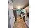 Efficient kitchen with stainless steel appliances and updated countertops, offering a bright and functional cooking space at 1736 Almand Creek Sw Dr, Conyers, GA 30094