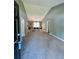 Bright living room with vaulted ceiling, carpet flooring, and a view into the dining area with modern furnishings at 1736 Almand Creek Sw Dr, Conyers, GA 30094