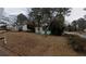 Cozy home featuring a screen porch, nestled among mature trees and a spacious front yard at 2010 Mcafee Pl, Decatur, GA 30032