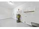 Basement featuring painted floors, water heater, and white storage cabinets at 2683 Stardust Trl, Decatur, GA 30034