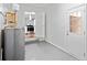 Basement with open doorway to the kitchen area, painted concrete floors, and water heater at 2683 Stardust Trl, Decatur, GA 30034