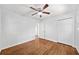 Bedroom with hardwood flooring, a ceiling fan, and a closet with paneled doors at 2683 Stardust Trl, Decatur, GA 30034