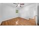 Spacious bedroom featuring hardwood floors, natural light, and a ceiling fan at 2683 Stardust Trl, Decatur, GA 30034