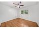 Bedroom with hardwood floors and a window overlooking trees at 2683 Stardust Trl, Decatur, GA 30034