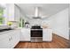 Bright kitchen features white cabinets, stainless steel appliances, and granite countertops at 2683 Stardust Trl, Decatur, GA 30034