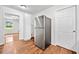 Kitchen area featuring stainless steel fridge and adjoining room at 2683 Stardust Trl, Decatur, GA 30034