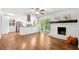 Open-concept space with a fireplace and the kitchen area featuring a breakfast bar at 2683 Stardust Trl, Decatur, GA 30034