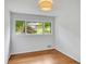 Bright bedroom with hardwood floors and large windows overlooking lush greenery at 3270 Leslie Ne Ct, Atlanta, GA 30345