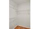 Walk-in closet features white walls, wood floor, and multiple levels of wire shelving at 3270 Leslie Ne Ct, Atlanta, GA 30345