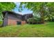 Back exterior of the home with a brick lower level and spacious yard at 3270 Leslie Ne Ct, Atlanta, GA 30345