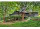 Charming exterior of a home with a large back deck and well-manicured landscaping at 3270 Leslie Ne Ct, Atlanta, GA 30345
