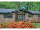 Brick exterior featuring a front yard, double door, and large windows at 3270 Leslie Ne Ct, Atlanta, GA 30345