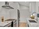 Bright kitchen features stainless steel appliances, quartz countertops, gas range, and white subway tile at 3270 Leslie Ne Ct, Atlanta, GA 30345
