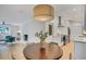 Open kitchen with white brick, modern appliances, and view to a comfortable sitting and dining area at 3270 Leslie Ne Ct, Atlanta, GA 30345