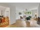 Cozy sitting area with white brick fireplace, tile flooring, modern furniture, and ample natural light at 3270 Leslie Ne Ct, Atlanta, GA 30345