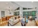 Bright and open living space connects dining to living area with access to an outdoor deck at 3270 Leslie Ne Ct, Atlanta, GA 30345