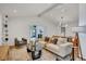 Bright living room with vaulted ceilings, recessed lighting, stylish decor, and hardwood floors at 3270 Leslie Ne Ct, Atlanta, GA 30345